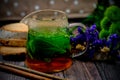 Pretty glass teacup with herbal tea