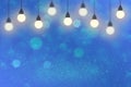 Pretty glossy glitter lights defocused bokeh abstract background with light bulbs and falling snow flakes fly, festival mockup