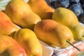 Pretty Golden Bartlett Pear Display in Farmer`s Market Royalty Free Stock Photo