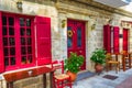 Pretty Greek island coffee shop front door with sidewalk tables Lefkada Greece Royalty Free Stock Photo