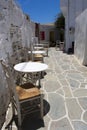 Pretty Greek island of Sikinos Charming old village Taverna tables and chairs in an alley