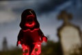 Pretty halloween photo with lego minifigure of a phantom in a cemetery