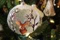 Pretty hand painted ornaments on holiday tree inside garden shop, Saratoga Springs, New York, 2019