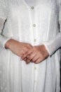 Pretty hands of a lady or woman wearing white dress or fashion or style