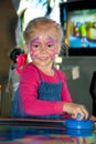 Pretty happy child playing table air hockey Royalty Free Stock Photo