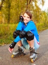 Pretty happy girl with rollerskates