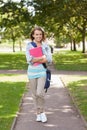 Pretty happy student carrying notebook Royalty Free Stock Photo