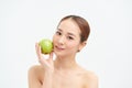 Pretty healthy young woman smiling holding a green apple Royalty Free Stock Photo