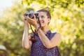 Pretty hipster taking a photo Royalty Free Stock Photo