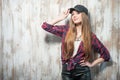 Pretty hipster woman with hat is standing near the Royalty Free Stock Photo