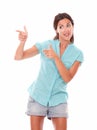 Pretty hispanic female pointing to her right Royalty Free Stock Photo