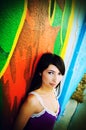 Pretty Hispanic Girl Against a Colorful Wall Royalty Free Stock Photo