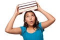 Pretty Hispanic Girl with Books on Her Head Royalty Free Stock Photo