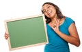 Pretty Hispanic Girl Holding Blank Chalkboard Royalty Free Stock Photo