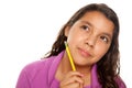 Pretty Hispanic Girl Thinking with Pencil Royalty Free Stock Photo