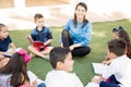 Teacher and pupils having fun outdoors