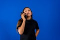 Pretty Hispanic teenage girl happily talking on the phone, she is happy because she is talking with her new boyfriend Royalty Free Stock Photo