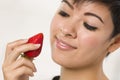 Pretty Hispanic Woman Holding Strawberry Royalty Free Stock Photo