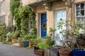 Picturesque terrace houses with blue front doors, built using Cotswold stone in Bradford on Avon, The Cotswolds, Wiltshire UK. Royalty Free Stock Photo