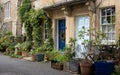 Picturesque terrace houses with blue front doors, built using Cotswold stone in Bradford on Avon, The Cotswolds, Wiltshire UK. Royalty Free Stock Photo