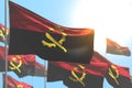 Nice many Angola flags are wave against blue sky illustration with bokeh - any occasion flag 3d illustration