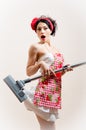 Pretty housewifÃÆ attractive young woman sexually funny pin-up girl is surprised because the vacuum cleaner eats her dress