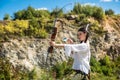 hunter girl shooting bow and arrow in the grassland Royalty Free Stock Photo