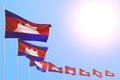 Pretty independence day flag 3d illustration - many Cambodia flags placed diagonal on blue sky with place for content