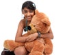 Pretty Indian girl embracing teddy bear Royalty Free Stock Photo