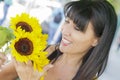 Pretty Italian Woman Looking at Sunflowers at Market Royalty Free Stock Photo