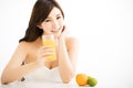 Pretty joyful young woman holding oranges juice