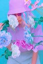 Pretty Kawaii Ladyl in bloom flowers. Trendy bucket hat. Summer Kisses you Royalty Free Stock Photo