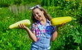 Pretty kid on farm. beauty of summer nature. little girl on farming garden with squash. growing vegetable marrow. happy Royalty Free Stock Photo