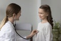 Pretty kid girl visiting pediatrician for medical checkup