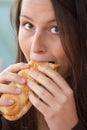 Pretty lady eating sandwich