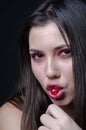 Pretty lady with fleshy lips, sucking a sweet cherry Royalty Free Stock Photo