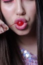 Pretty lady with fleshy lips, sucking a sweet cherry Royalty Free Stock Photo