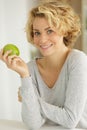 pretty lady holding green apple Royalty Free Stock Photo