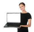 Pretty lady presenting a new laptop on white