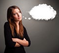 Pretty lady thinking about cloud speech or thought bubble with c Royalty Free Stock Photo