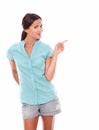 Pretty latin female pointing to her left Royalty Free Stock Photo