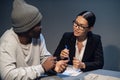 A pretty lawyer girl is having a conversation with a drug dealer client at the police station Royalty Free Stock Photo