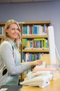 Pretty librarian working in the library