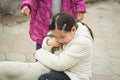 Pretty little asian girl palying with dog