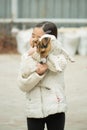 Pretty little asian girl palying with dog