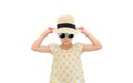 Pretty little asian kid girl wearing a sunglasses and straw hat isolated on white background. Summer and fashion concept. Front Royalty Free Stock Photo