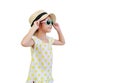 Pretty little asian kid girl wearing a sunglasses and straw hat isolated on white background. Summer and fashion concept. Side Royalty Free Stock Photo