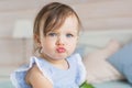 Pretty little baby girl is angry Royalty Free Stock Photo