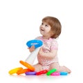 Pretty little child or kid playing with color toy