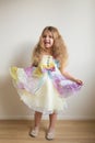 Pretty little dancing girl. Children`s holiday. Royalty Free Stock Photo